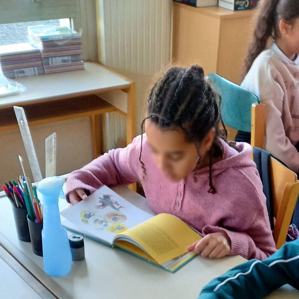 Phone-Free Classrooms Boost Grades in Major Student Study Students in a classroom studying without smartphones on their desks